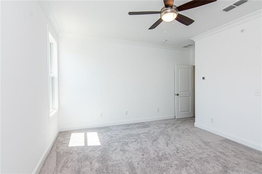 Primary Bedroom with Crown Molding . not the actual unit previously built