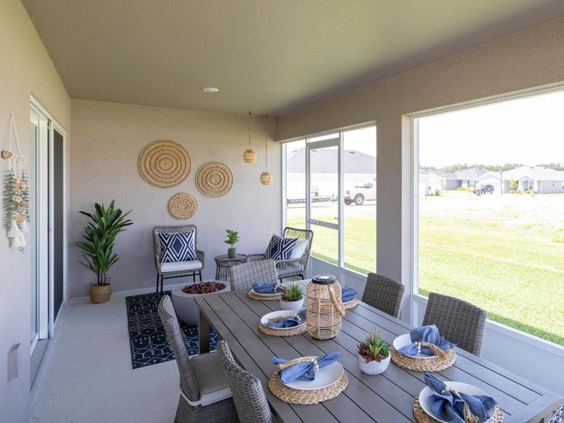 The interior opens to outdoor living space with a spacious screened lanai.