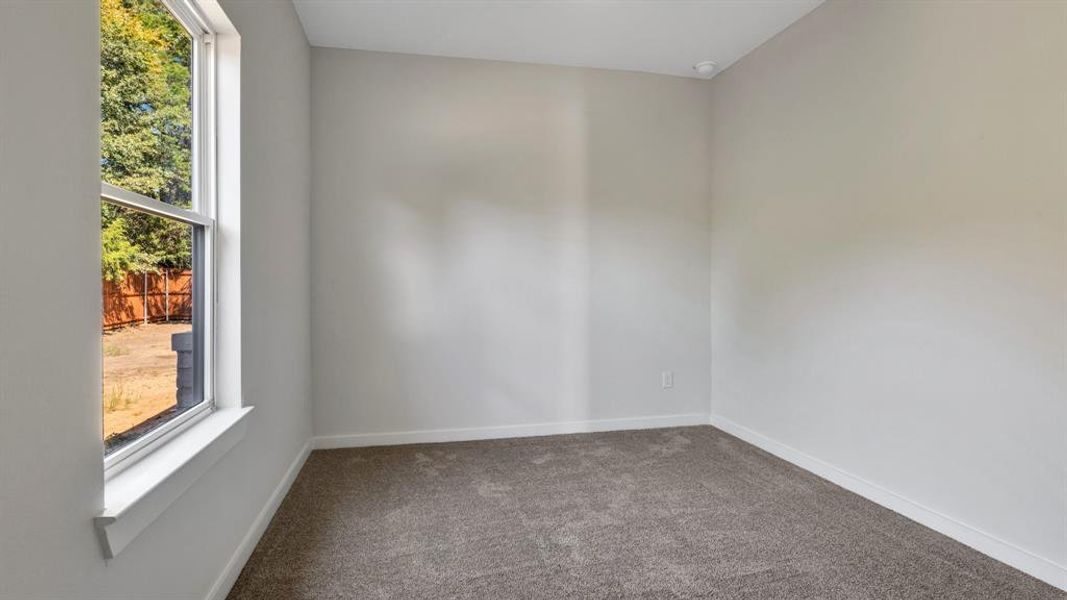 View of carpeted spare room