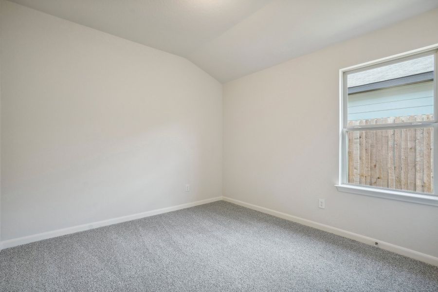 Guest bedroom in the Allen floorplan at a Meritage Homes community.