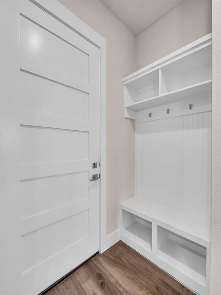 Mudroom with hardwood / wood-style flooring