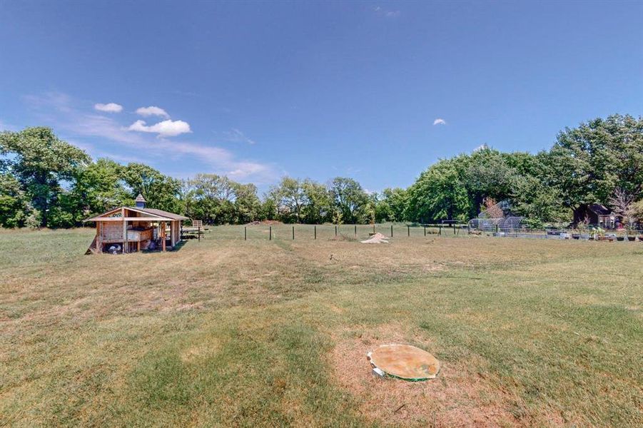 View of yard with a rural view