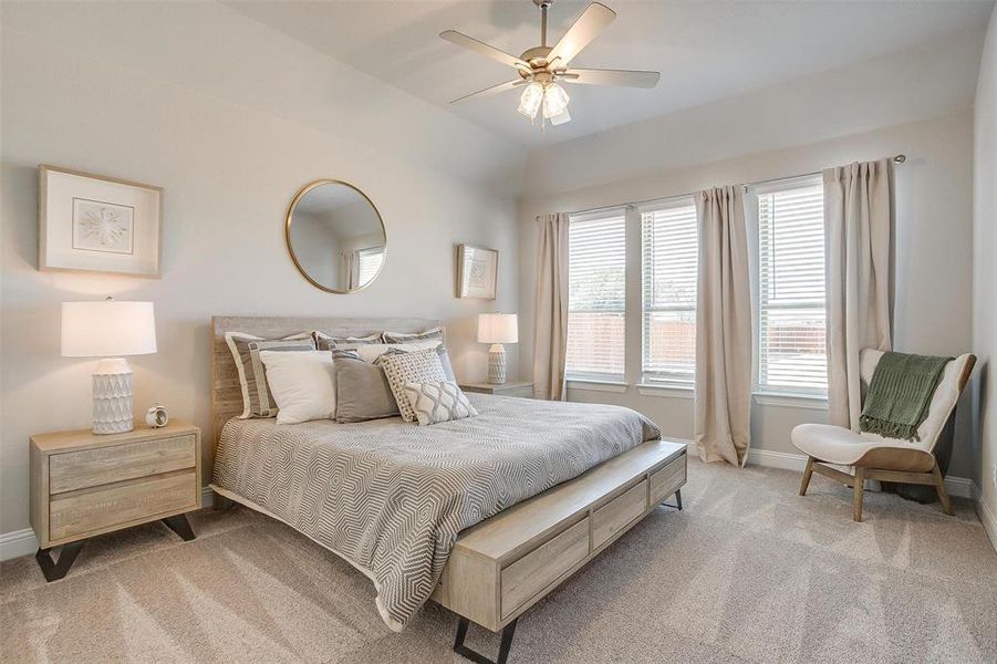 Bedroom featuring ceiling fan and light colored carpet