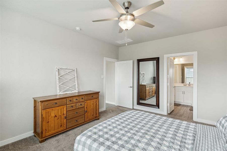 Primary bedroom and view of the en-suite entrance.