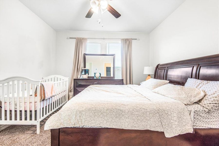 Bedroom with carpet flooring and ceiling fan