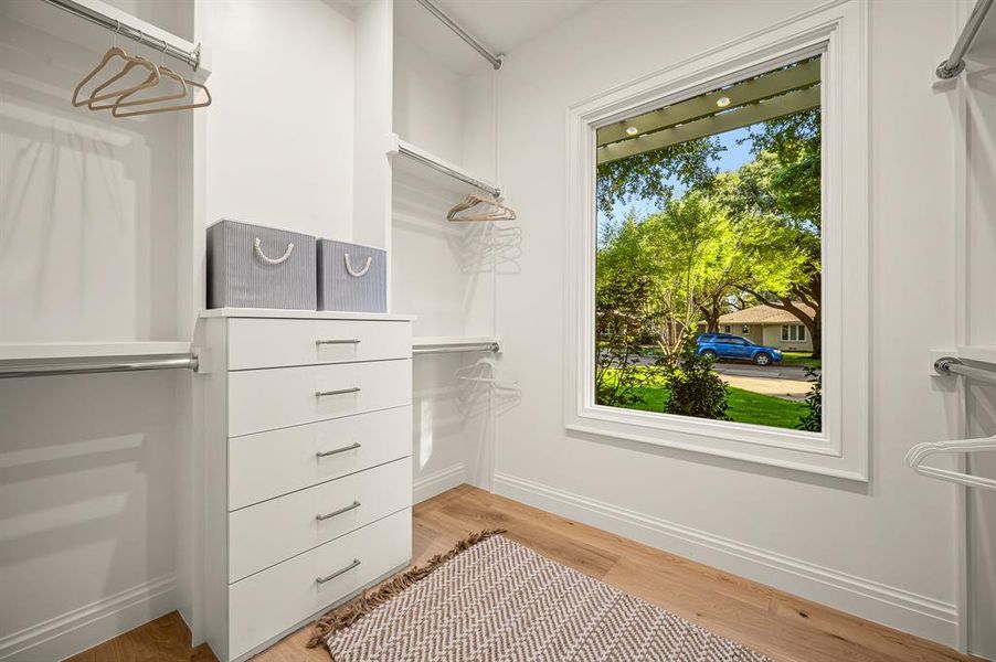 Spacious closet featuring hardwood / wood-style flooring