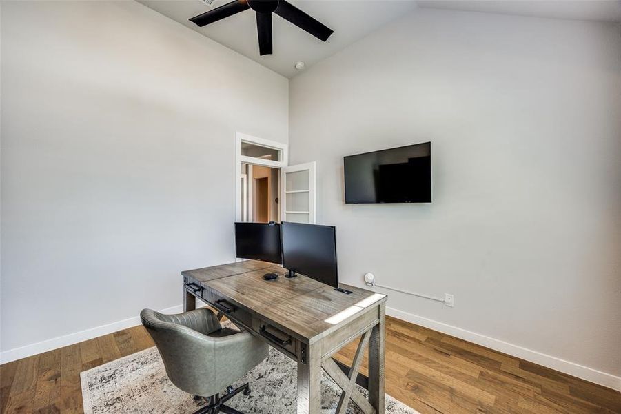 Office area featuring  vaulted ceiling and ceiling fan