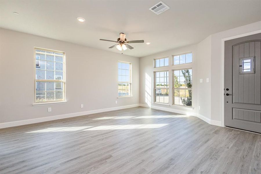 Entrance foyer featuring light hardwood / wood-style flooring and ceiling fan