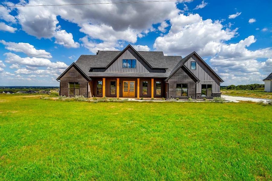 View of front of property featuring a front lawn