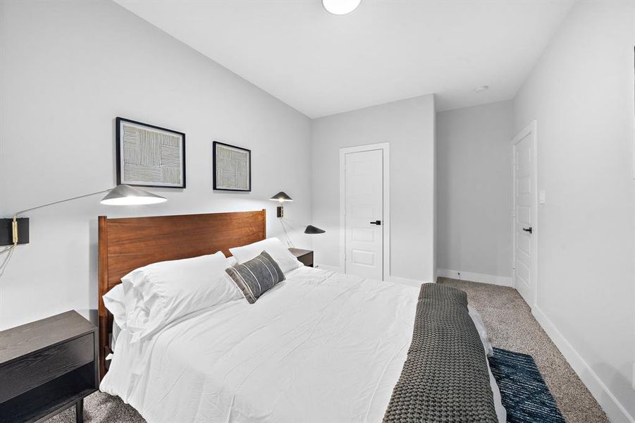 Bright second bedroom with clean lines and a minimalist approach, creating a refreshing and inviting atmosphere.