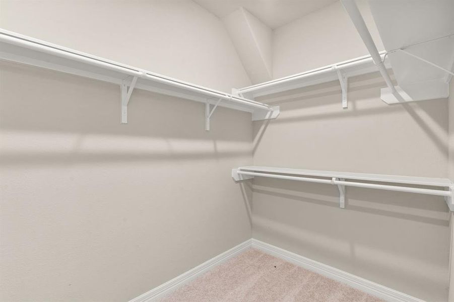 A view of your primary walk-in closet