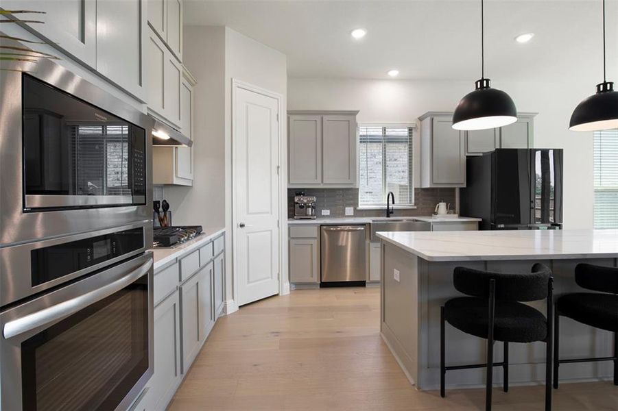 Convection oven, gas cooktop, and apron-front sink