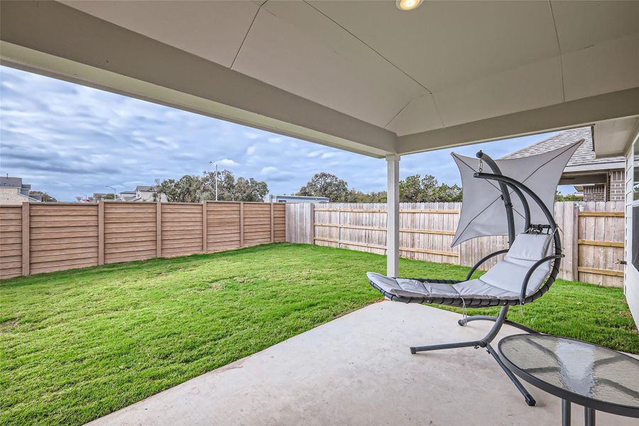 Step outside where you can relax and enjoy an evening sky or grill to your heart's content.  There's room for everyone under this covered patio!