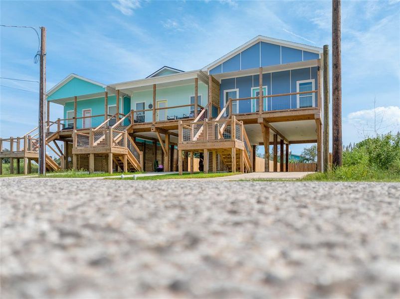 The photo shows the front of the  house from street level.