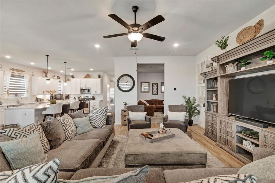 Inviting Family Room - Open layout with the kitchen and dining room to the left, media room entry ahead, and plenty of space for family gatherings.