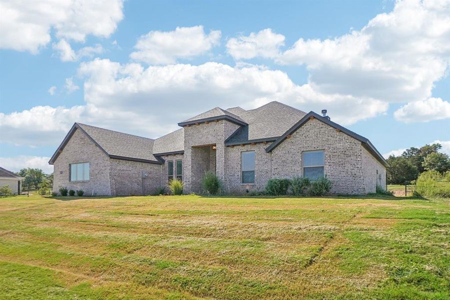 View of front of property featuring a front lawn