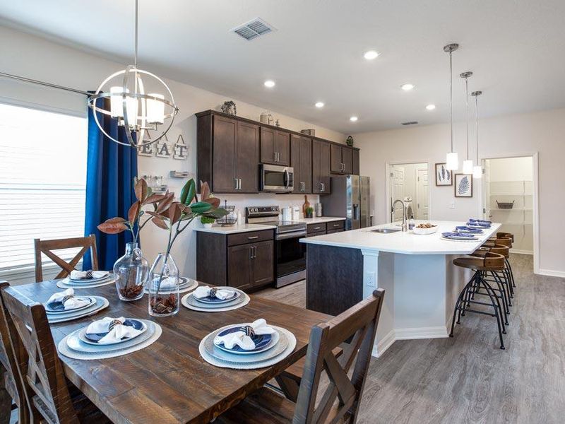 Sunny cafe area adjacent to kitchen with island bar for plenty of dining space - Shelby home plan by Highland Homes