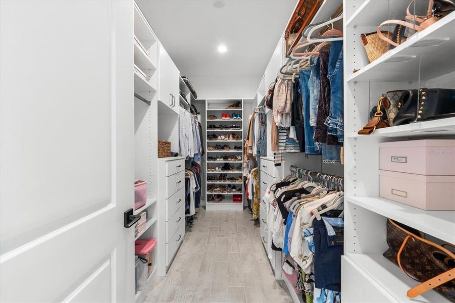 Custom closet in primary bathroom.