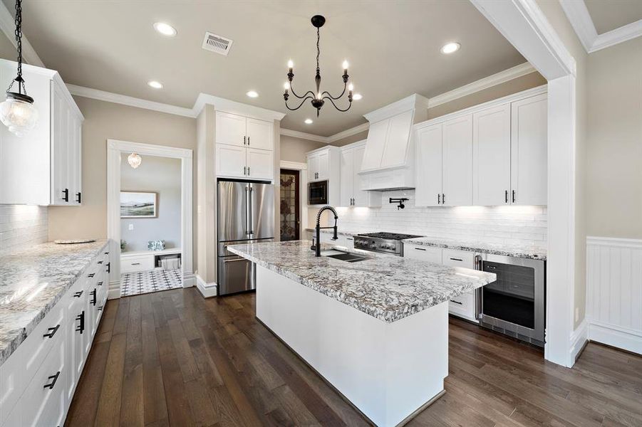 Island seating for up to 4. Stainless steel appliances throughout. Peek into the mudroom on far left of photo