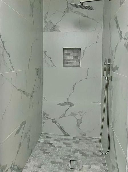 Bathroom with tiled shower