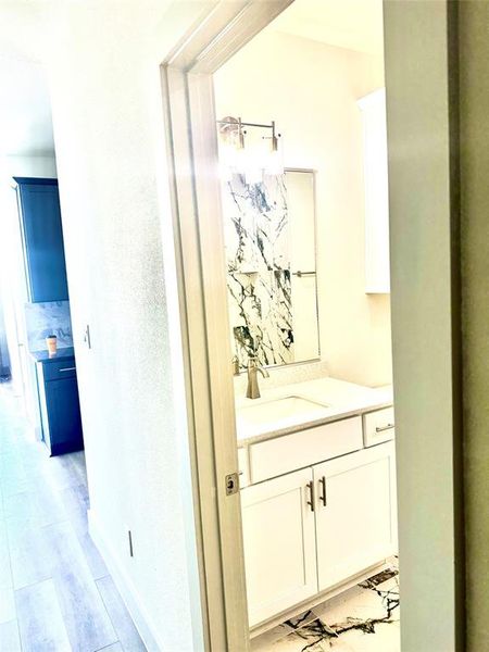 Bathroom featuring vanity and hardwood / wood-style floors