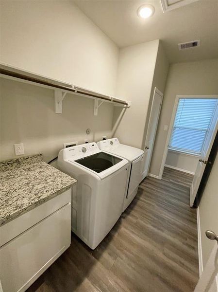 Granite folding counter, broom closet & the washer/dryer are included!