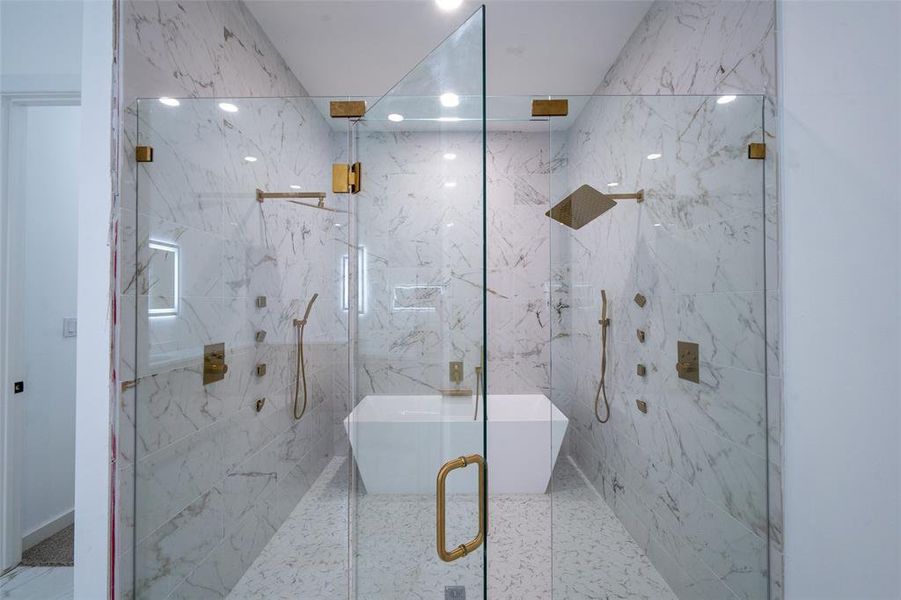 Bathroom featuring separate shower and tub