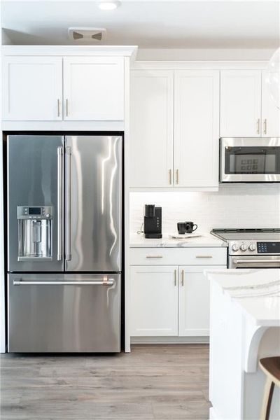 Upgraded appliances in every home with optional Refrigerator