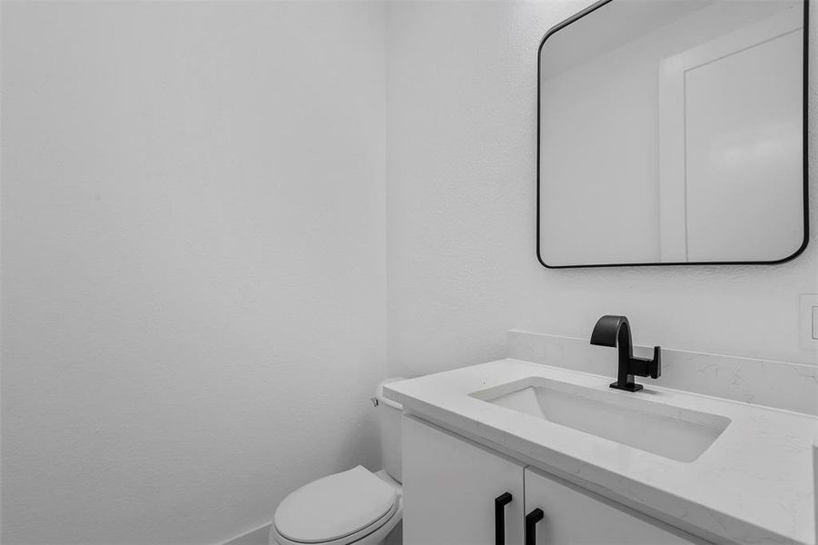 Bathroom with toilet and vanity