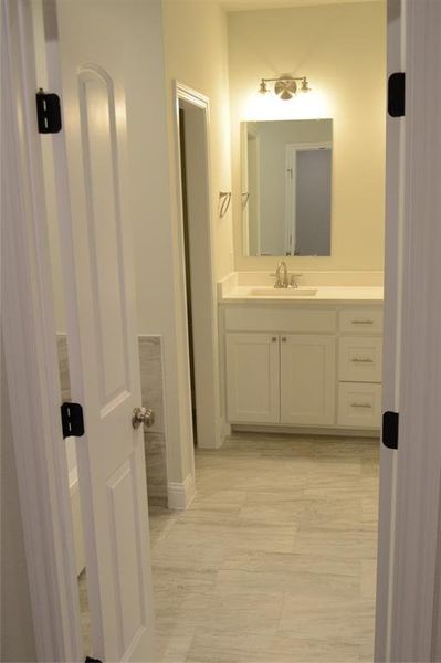 Bathroom featuring vanity, separate free standing tub and shower