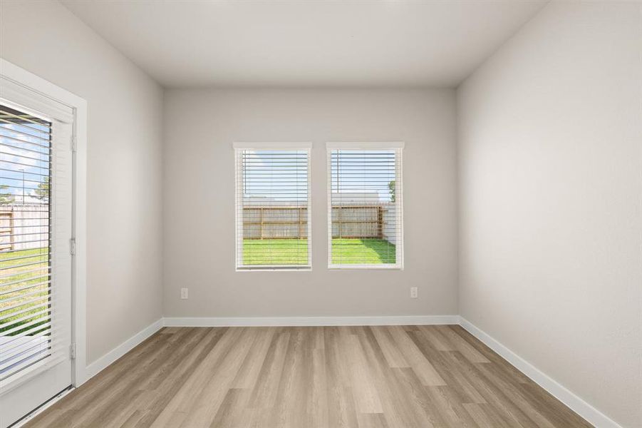 Oversized windows provide a stunning view of the Beautiful Backyard from the Gourmet Kitchen and breakfast area.