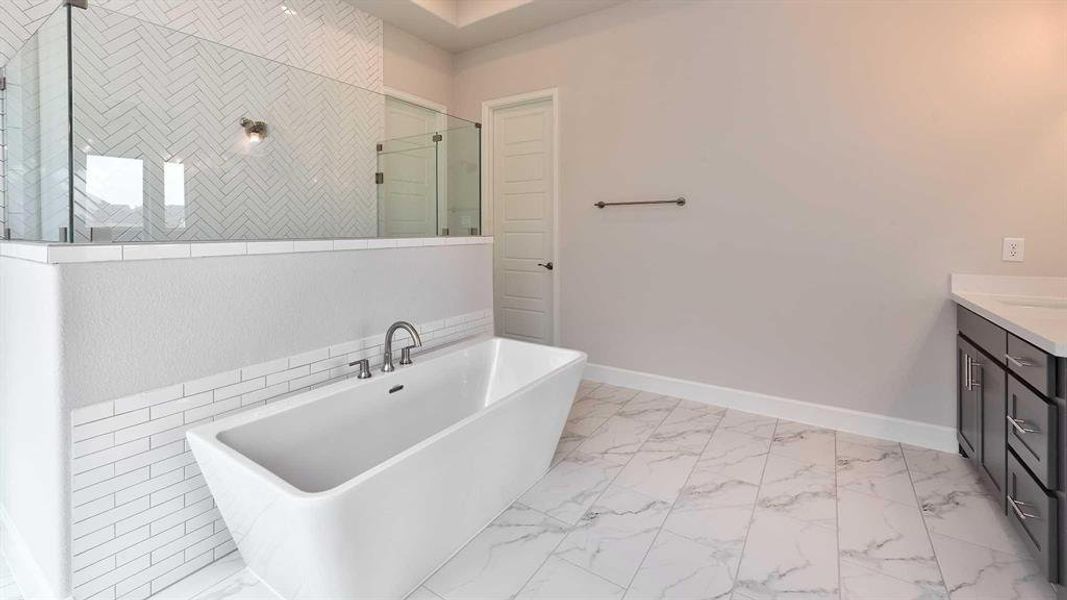 Bathroom with vanity, tile patterned flooring, and tile walls