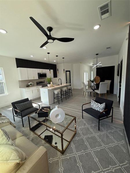 Living room with Smart ceiling fan, Smart pendant style lighting. Wood-style Luxury Plank Vinyl flooring, Smart entryway and  Dining room lighting