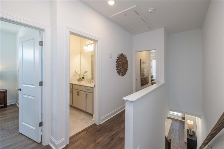 Hallway leading to the Secondary Bedrooms and the Owner Suite with a Secondary Bathroom . not the actual unit