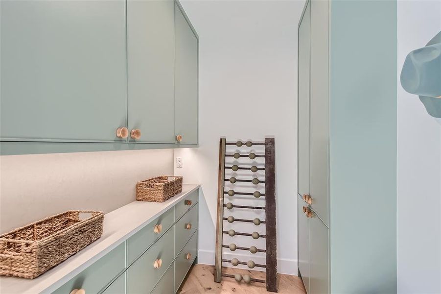 A mudroom with overflow storage is conveniently located off the kitchen.