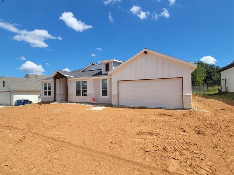 Ranch-style house featuring a garage