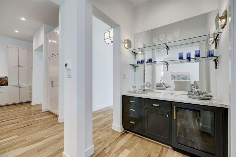 Dry bar off wine room and great room with beverage refrigerator