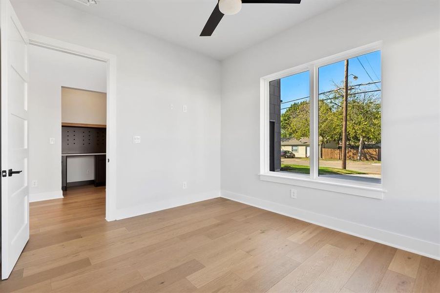 Spare room featuring ceiling fan and light hardwood / wood-style flooring