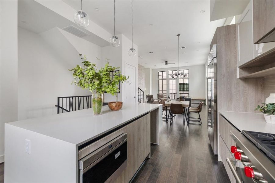 Experience the beauty of seamless living in this open floorplan, where the kitchen effortlessly flows into the dining area and living space.