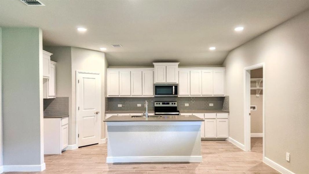 Kitchen - All Home and community information, including pricing, included features, terms, availability and amenities, are subject to change at any time without notice or obligation. All Drawings, pictures, photographs, video, square footages, floor plans, elevations, features, colors and sizes are approximate for illustration purposes only and will vary from the homes as built.