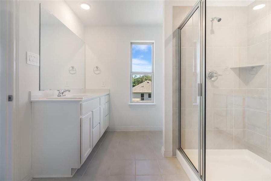 The primary ensuite bath features an XL Walk-in shower, plus His & Her separate vanities