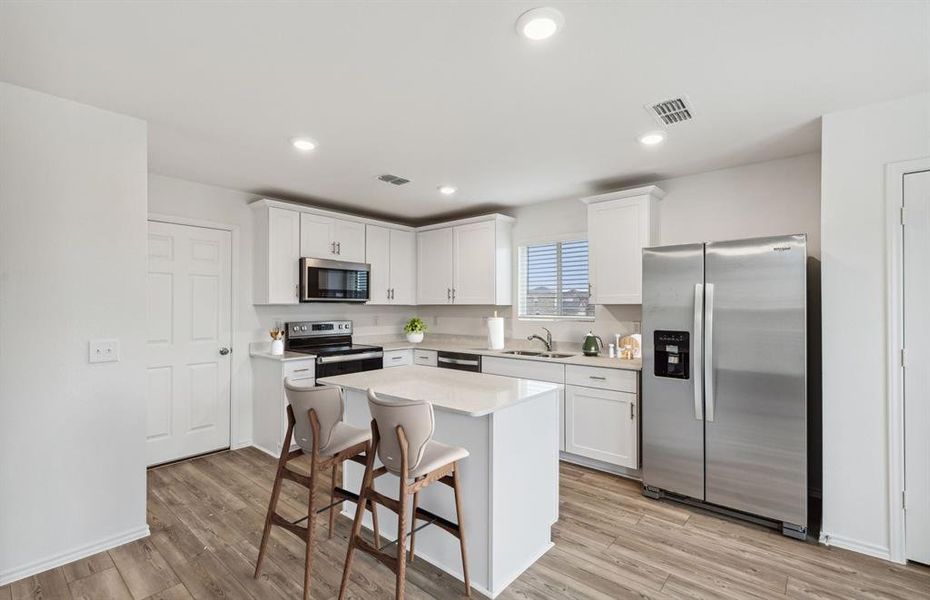 Airy kitchen with ample cabinet space  *Photos of furnished model. Not actual home. Representative of floor plan. Some options and features may vary.