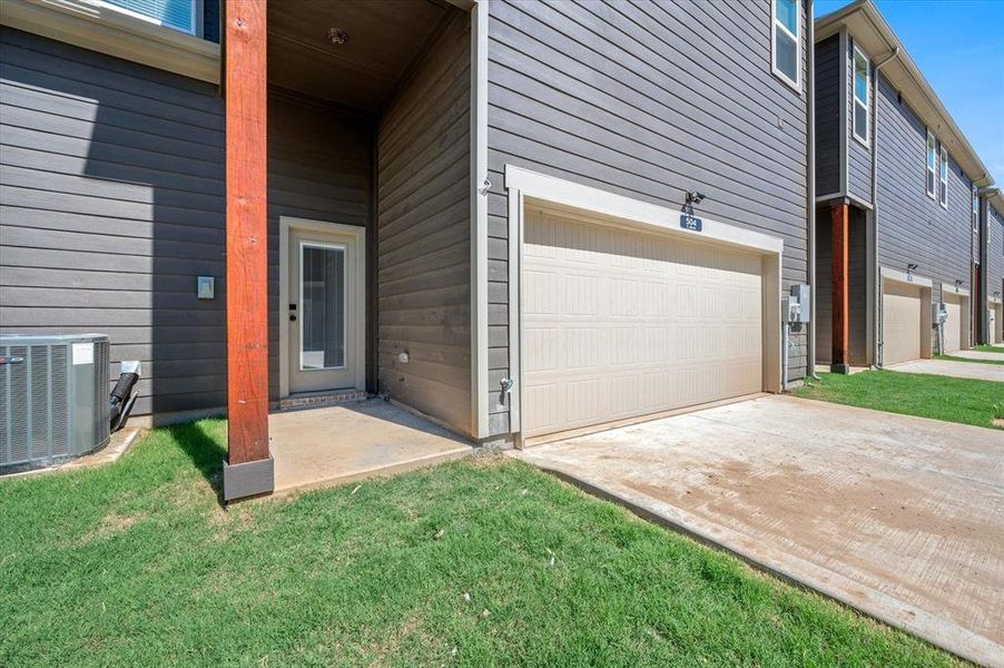 Soaring covered back Porch, Security Lighting, Exterior Electric Outlet, Grass aplenty