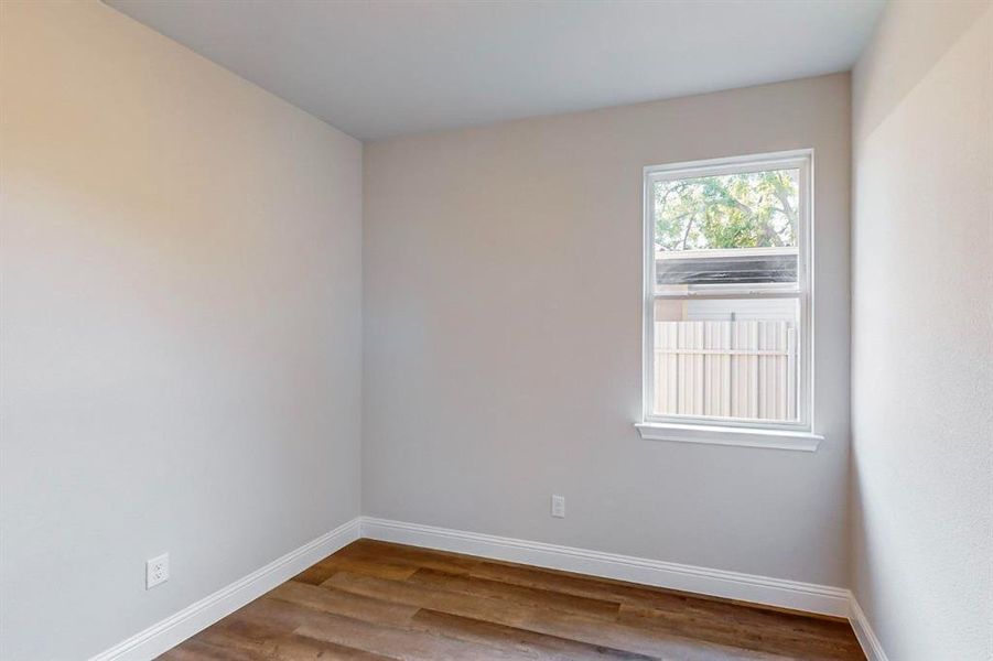 Unfurnished room with wood-type flooring