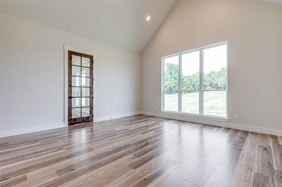 master bedroom with an adjoining office and beautiful view of the golf course