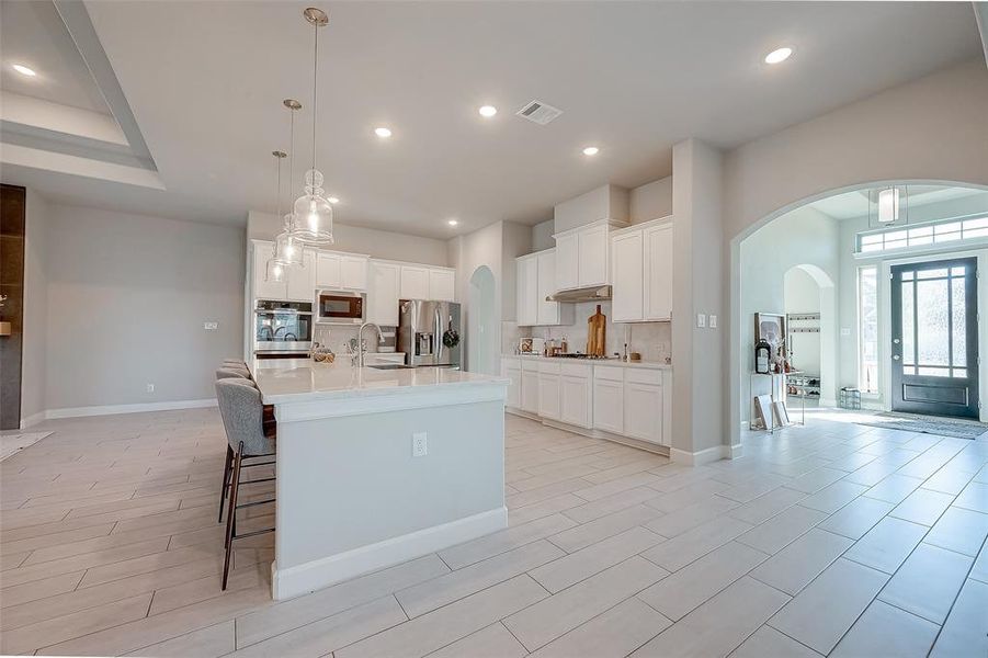 Step into this modern kitchen, wherefunctionality meets sophistication.