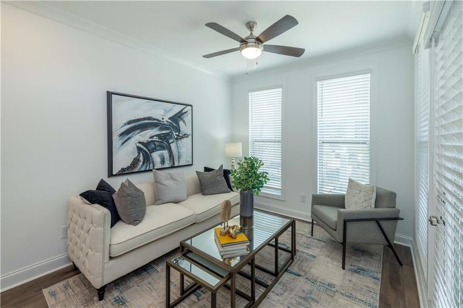 Sun  room with ceiling fan, crown molding, and hardwood / wood-style flooring , not the actual unit