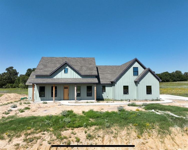 Modern farmhouse featuring covered porch