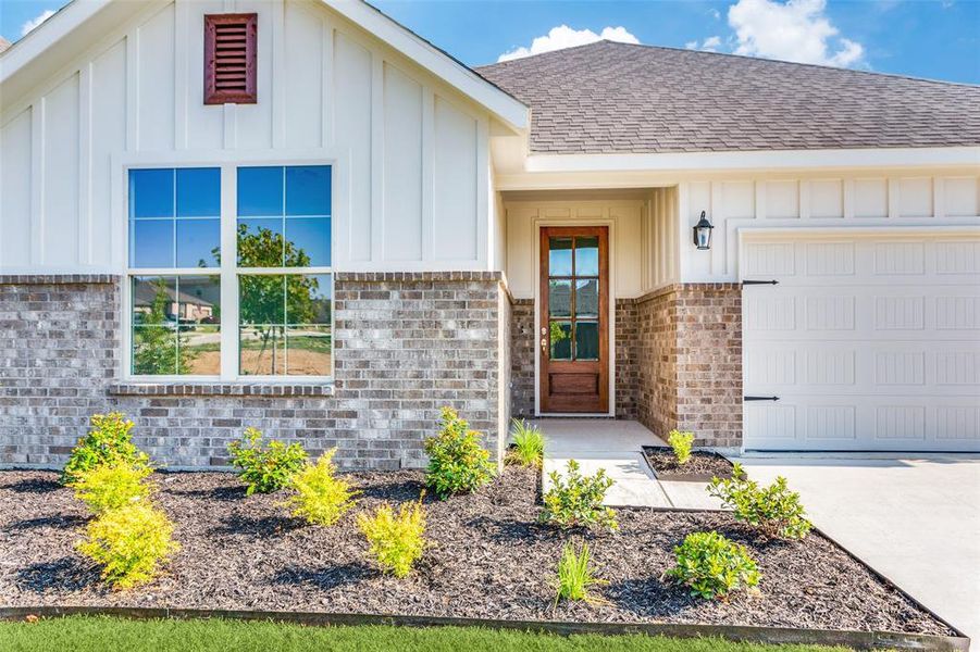 View of front of property featuring a garage