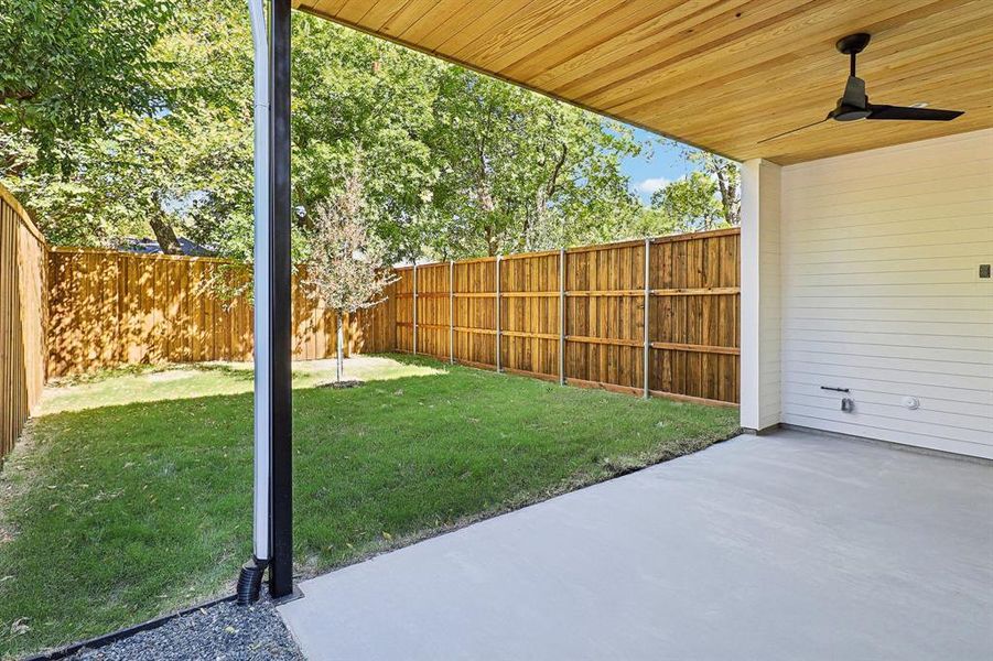 View of yard featuring a patio and ceiling fan